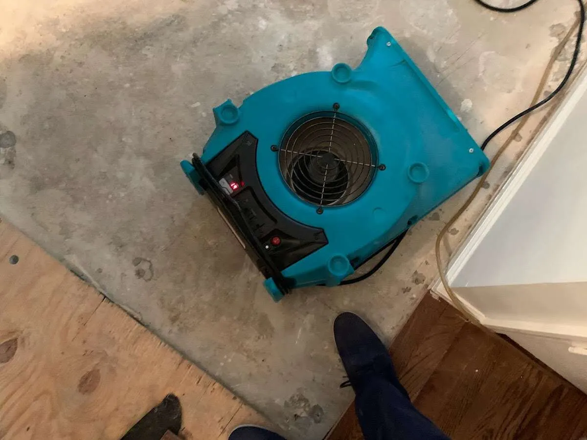 Air mover drying subfloor during Leak Detection & Repair in Security-Widefield