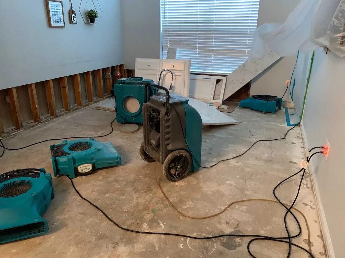 Dehumidifier in flood-cut room for Water Damage Restoration in Security-Widefield